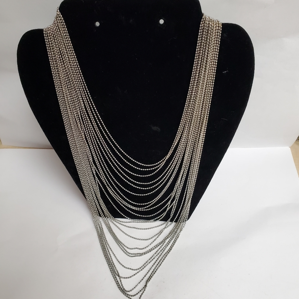 This Multi-Stranded 22 Chains Silvertone Statemen… - image 1